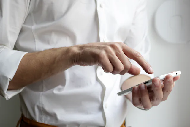 A guest holding a smartphone