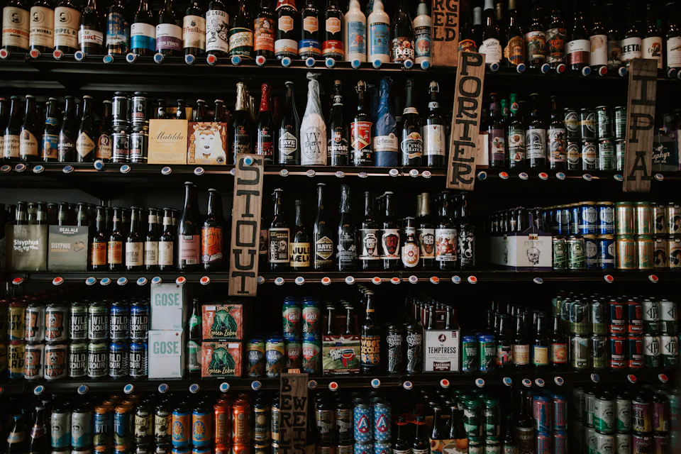 Friends raising glasses of beer over dinner