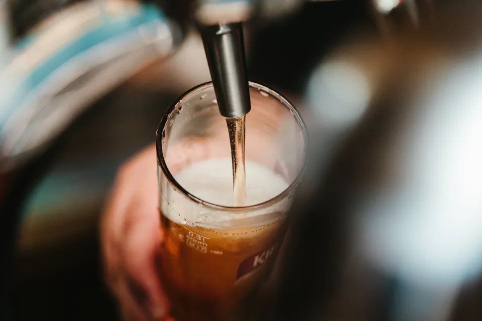 A beer being poured from the tap