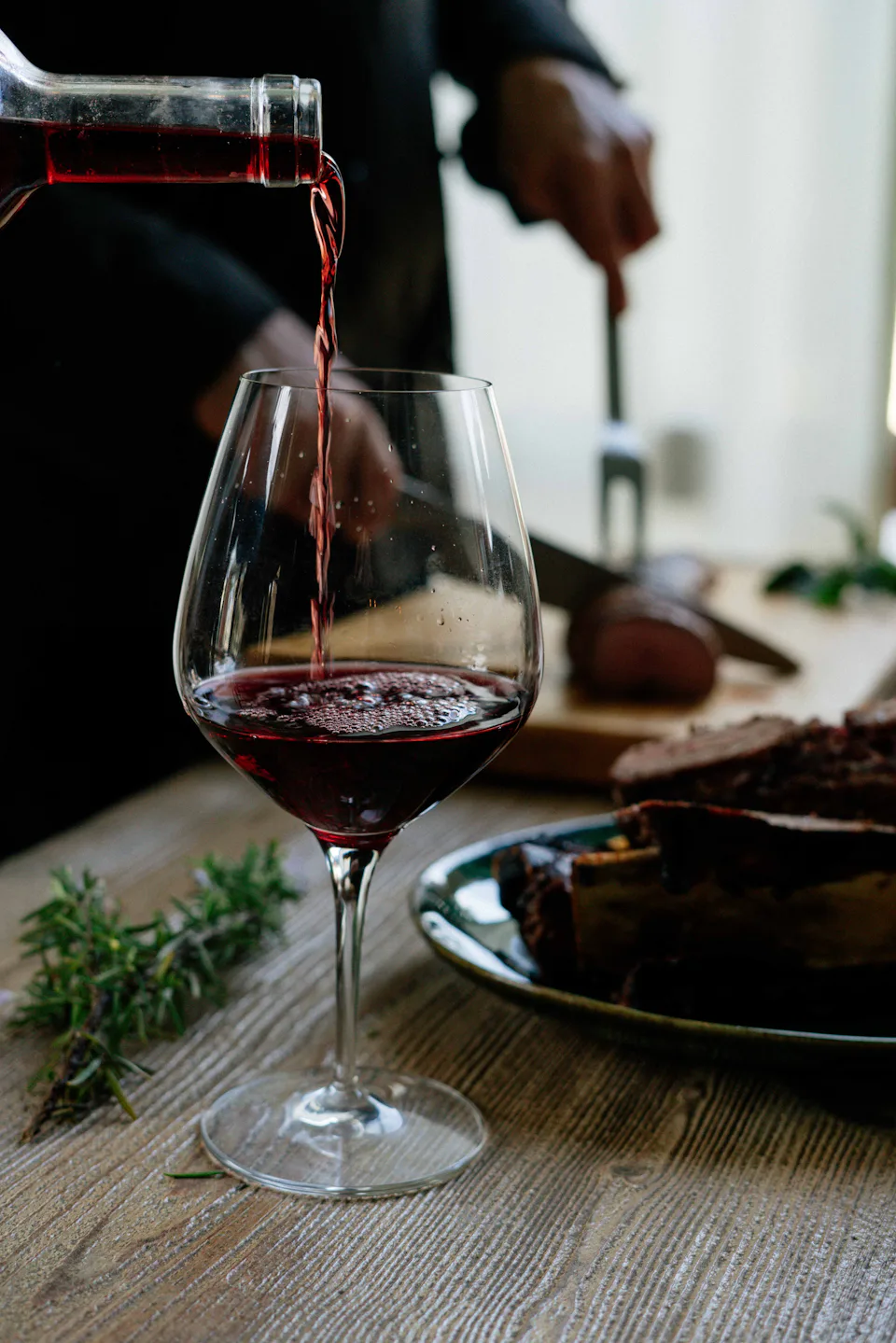 Red wine being poured into a glass
