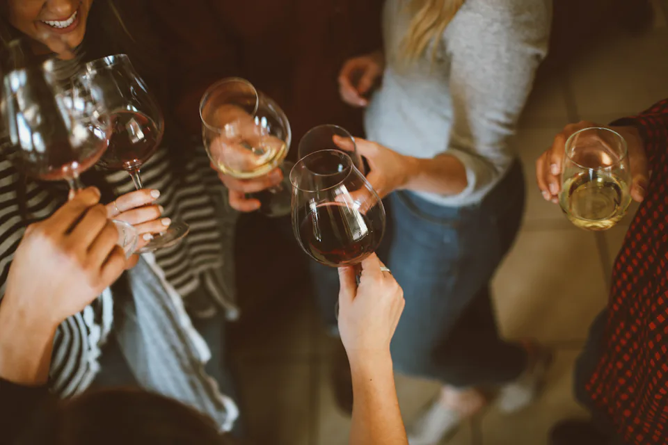 Guests raising glasses at a table